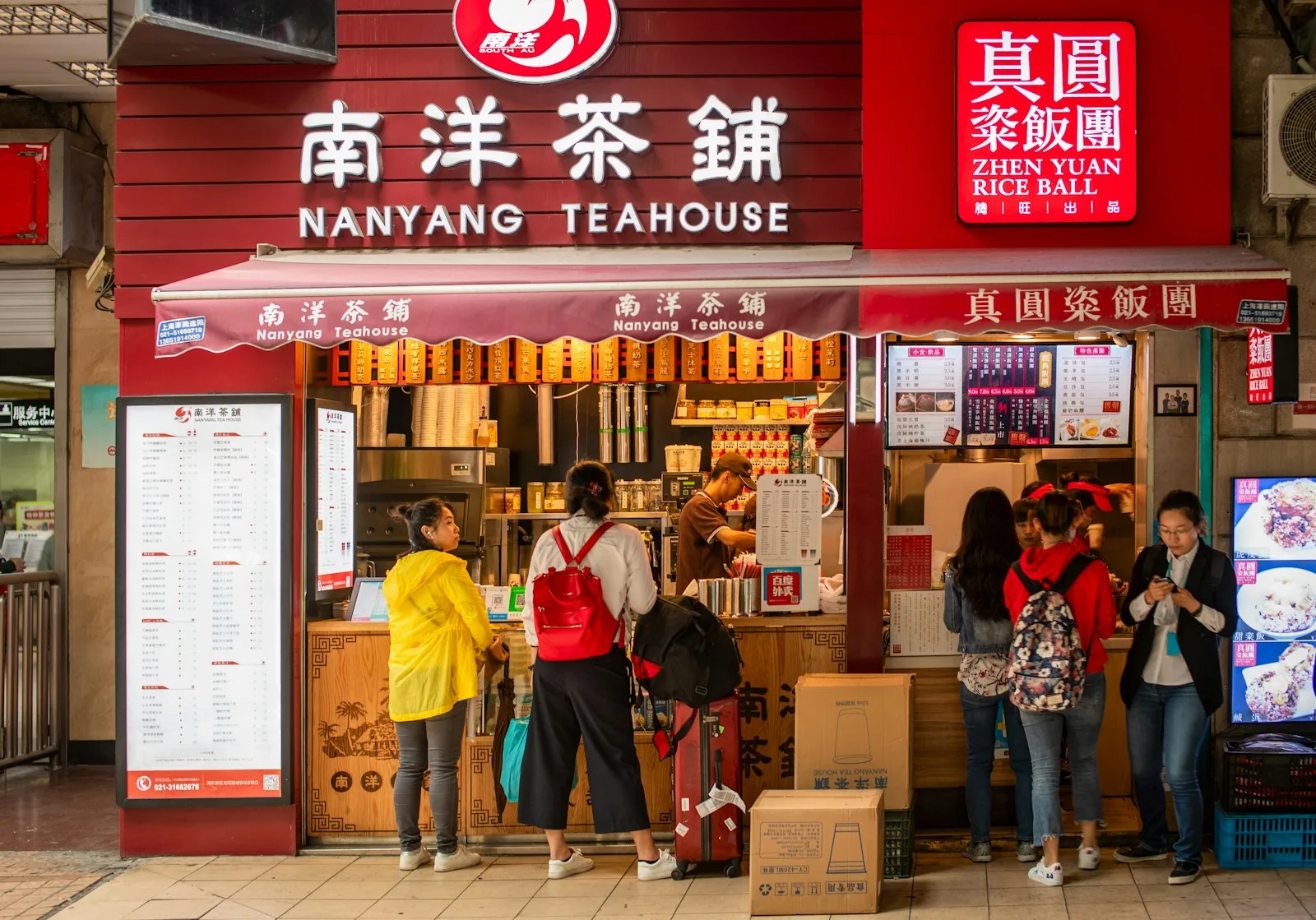 Customers gathering at a neighborhood teahouse counter in Shanghai